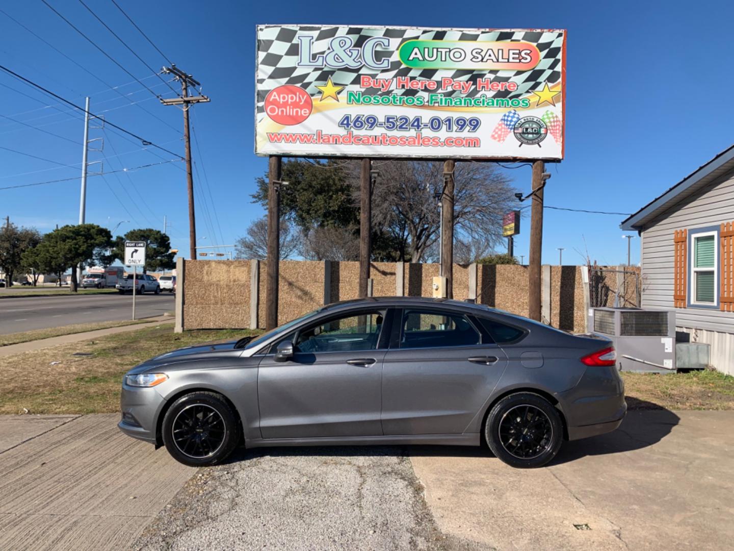 2013 Black /Black Ford Fusion (3FA6P0H79DR) with an 4 Cylinders D 1.5L DI Turbo DOHC 091 CID engine, AUTOMATIC transmission, located at 1830 North Belt Line Road, Irving, TX, 75061, (469) 524-0199, 32.834373, -96.993584 - Photo#0